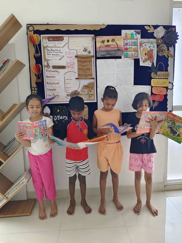 Student reading a story aloud in class