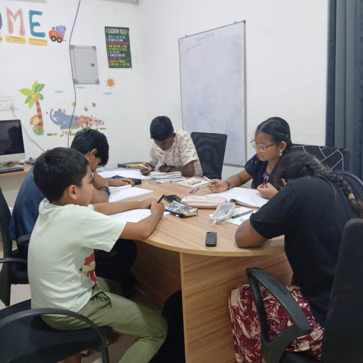 Students working together around a round table.