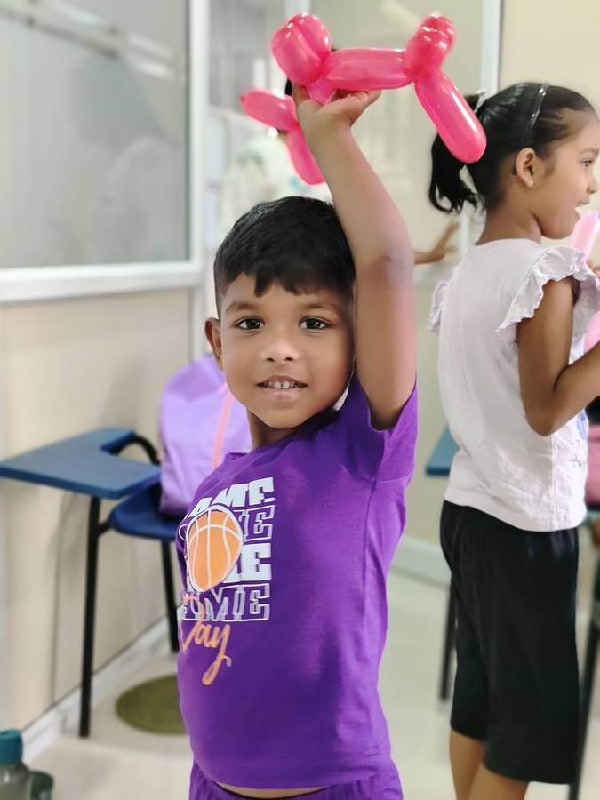 A proud balloon-animal maker