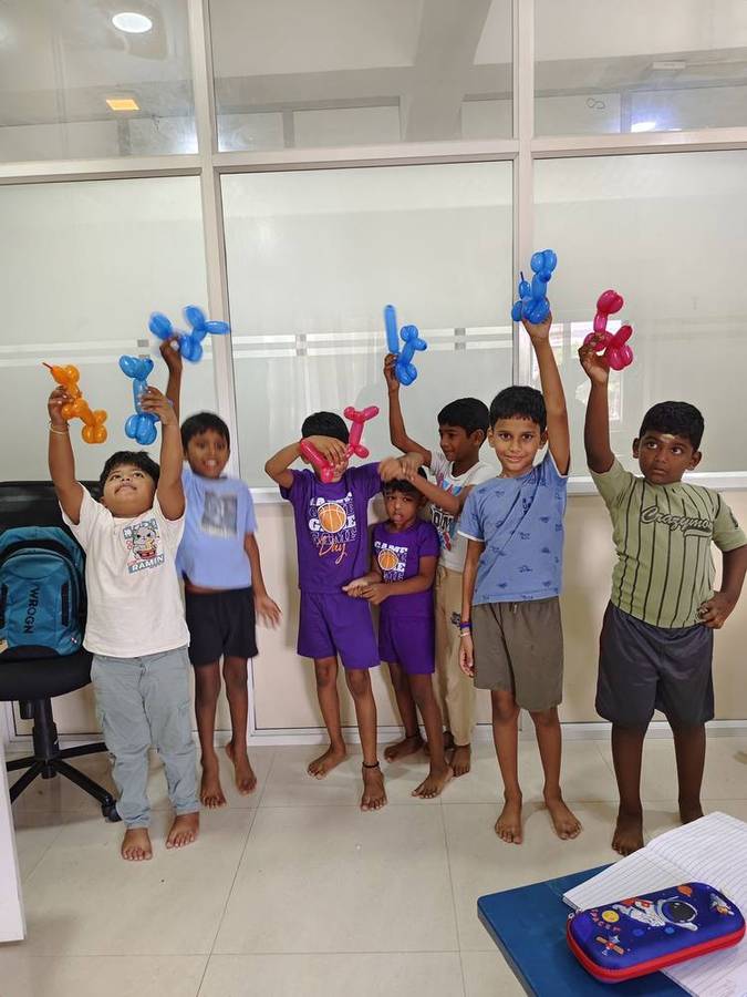 Children celebrating with balloon creations